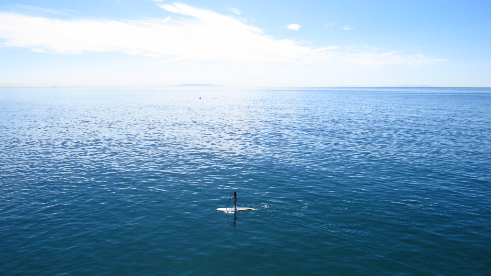 woman paddleboarding in malibu